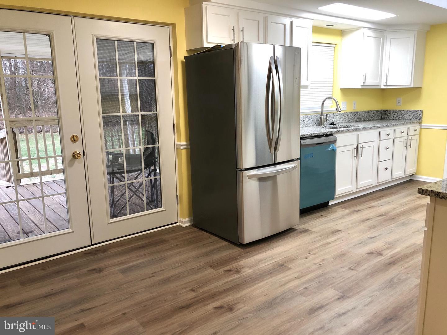 114 River Road Edgewater, MD 21037 - Photo 5 of 33 Kitchen w/ doors to deck