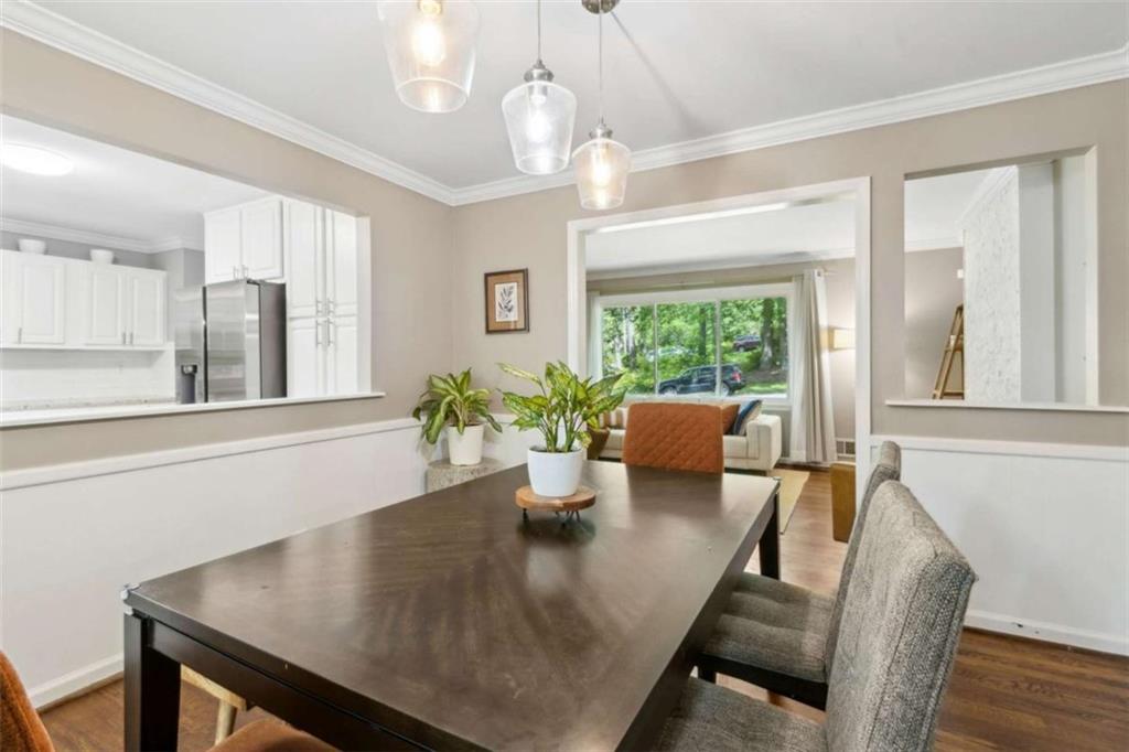 3362 Northbrook Drive Atlanta, GA 30340 - Photo 25 of 55 a view of a dining room with furniture a chandelier and wooden floor