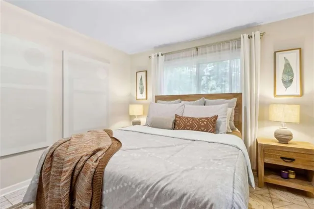 a bedroom with a bed and a dresser