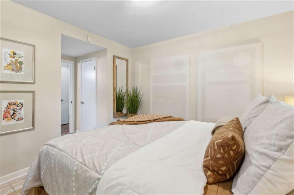 3362 Northbrook Drive Atlanta, GA 30340 - Photo 33 of 55 a bedroom with a bed and a painting on the wall