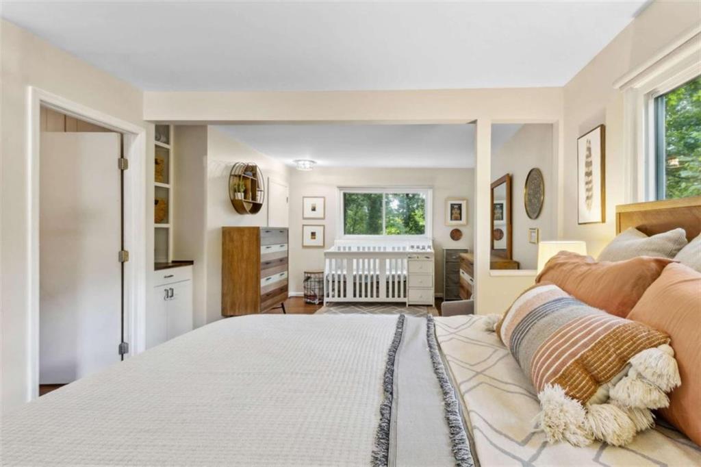 3362 Northbrook Drive Atlanta, GA 30340 - Photo 40 of 55 a bedroom with a bed and a large mirror