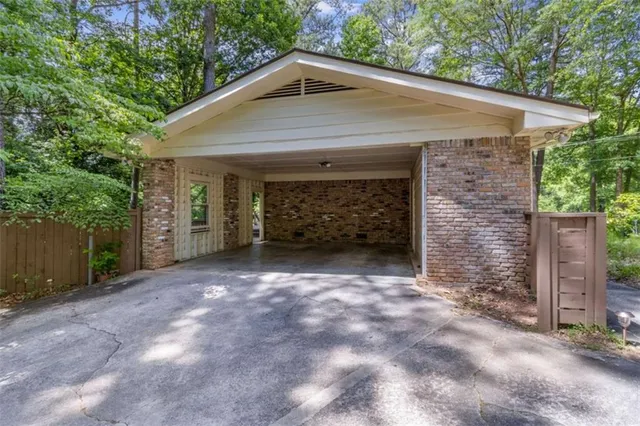 a front view of a house with parking space