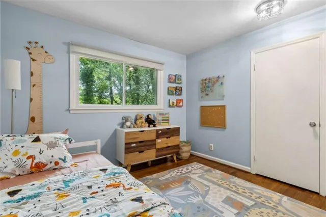 a view of balcony with wooden floor and fence