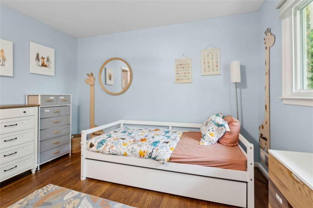 3362 Northbrook Drive Atlanta, GA 30340 - Photo 46 of 55 a bedroom with a bed and cabinets