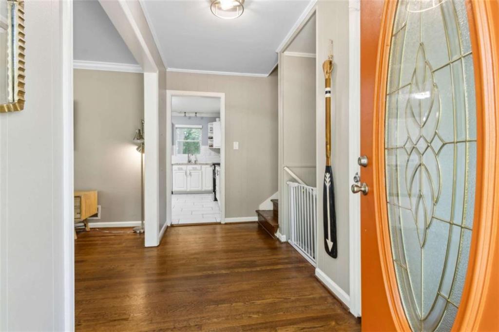 3362 Northbrook Drive Atlanta, GA 30340 - Photo 5 of 55 a view of a hallway with wooden floor and glass door
