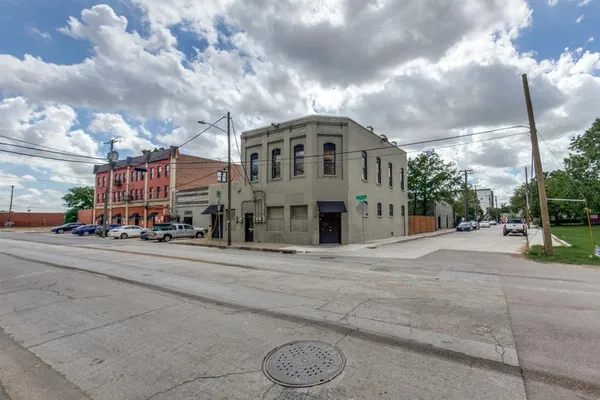 a view of a street with a building in the background