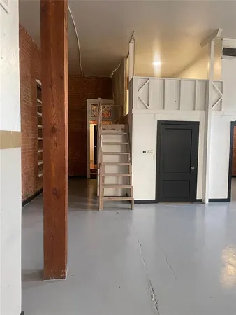 a view of a hallway with windows