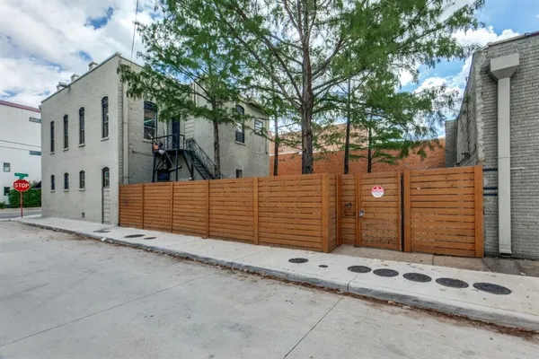 a view of a house with a fence