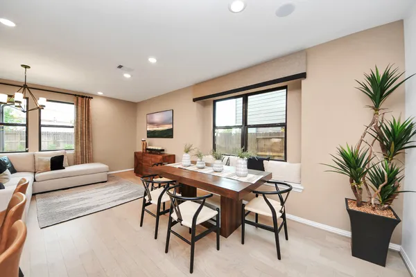 a kitchen with stainless steel appliances granite countertop a sink a stove and a refrigerator