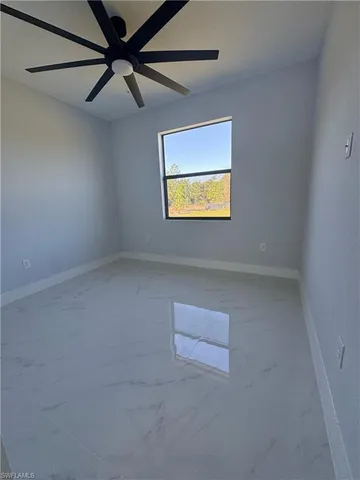 a spacious bathroom with double sink and a mirror