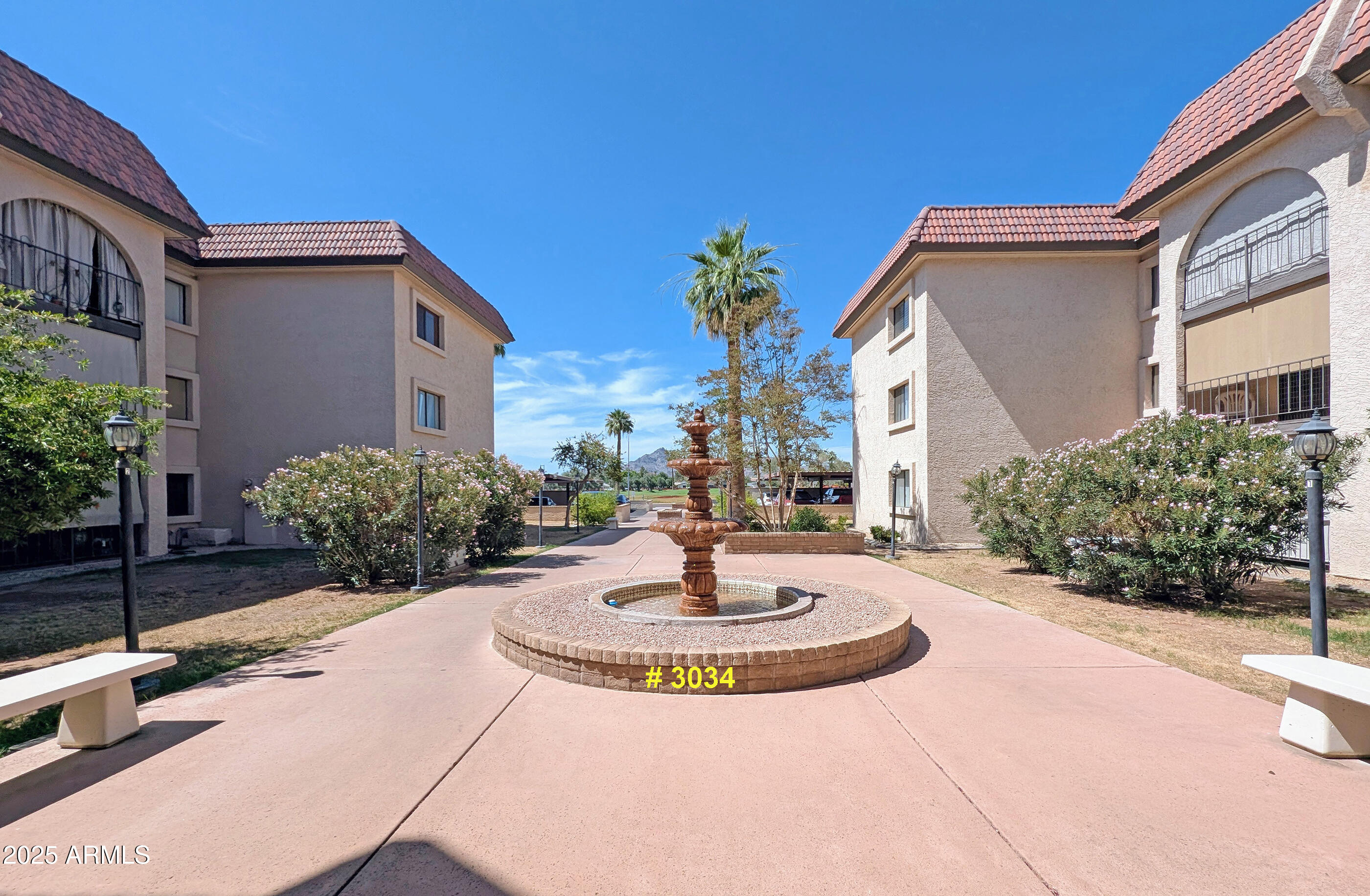 3033 East Devonshire Avenue, Unit 3034 Phoenix, AZ 85016 - Photo 10 of 14 a view of a building with a garden in the background