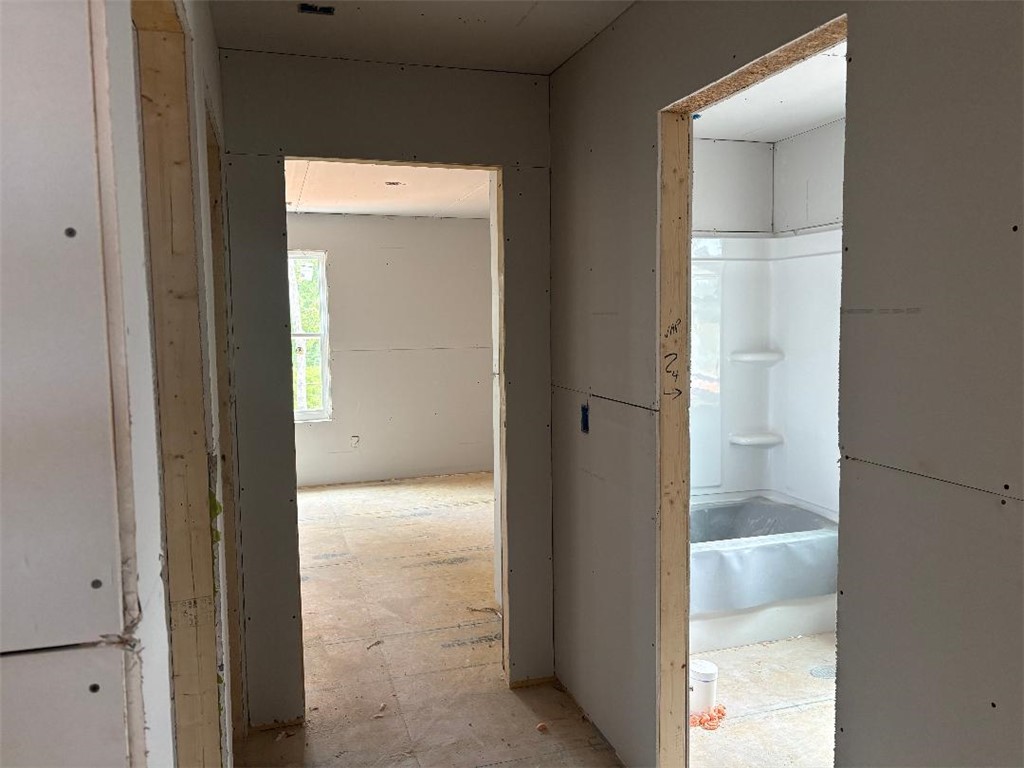 152 Cedar Shoals Easley, SC 29640 - Photo 10 of 15 This interior offers a clear view into a bathroom and another room, highlighting the home's potential.