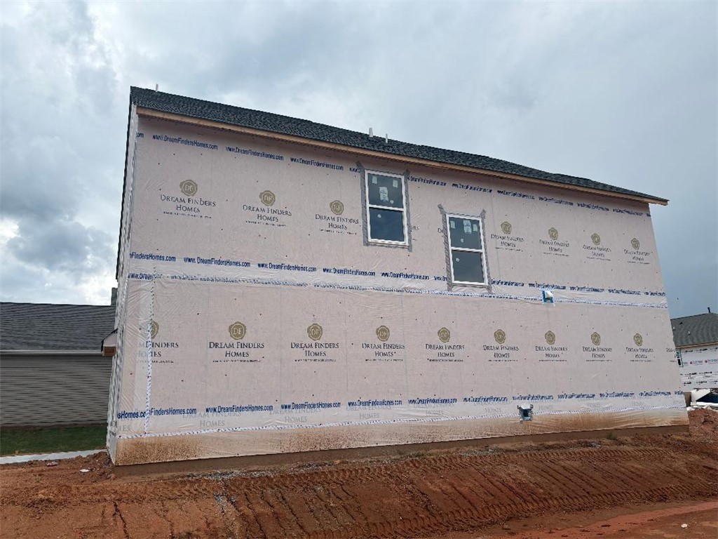 152 Cedar Shoals Easley, SC 29640 - Photo 4 of 15 Under-construction residence showcasing modern structural elements and a new roof.
