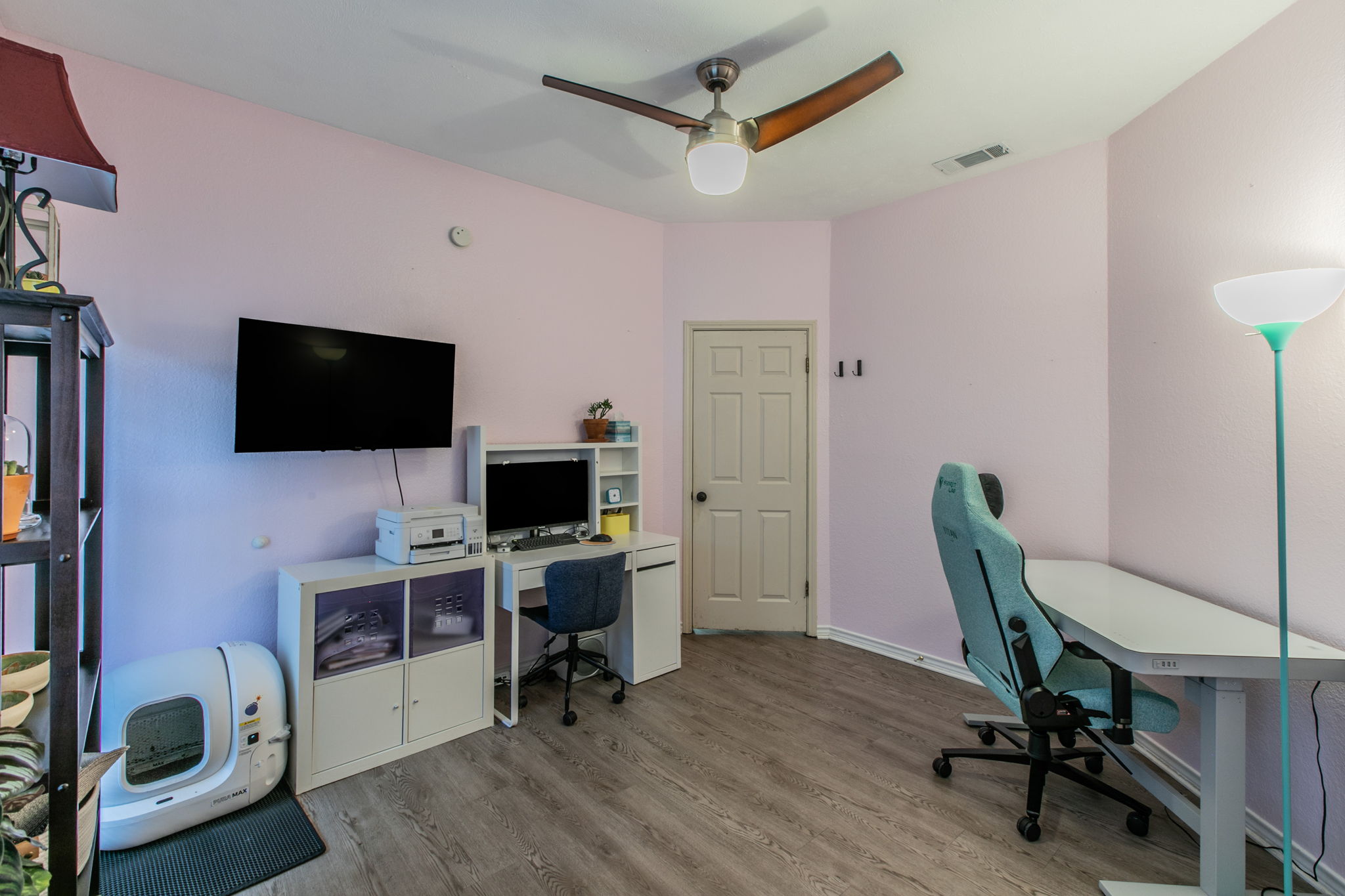 1005 North LBJ Drive, Unit B2 San Marcos, TX 78666 - Photo 11 of 19 a view of a workspace with furniture and a flat screen tv