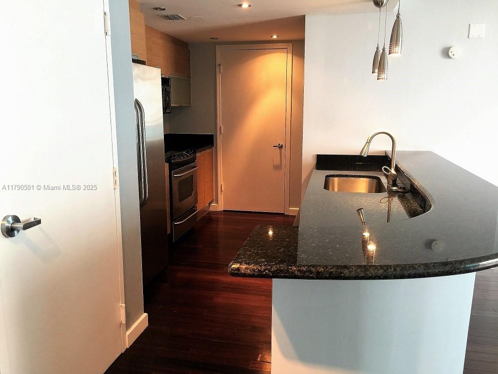 1881 79th Street Causeway, Unit 1106 North Bay Village, FL 33141 - Photo 8 of 20 a bathroom with a sink and a tub