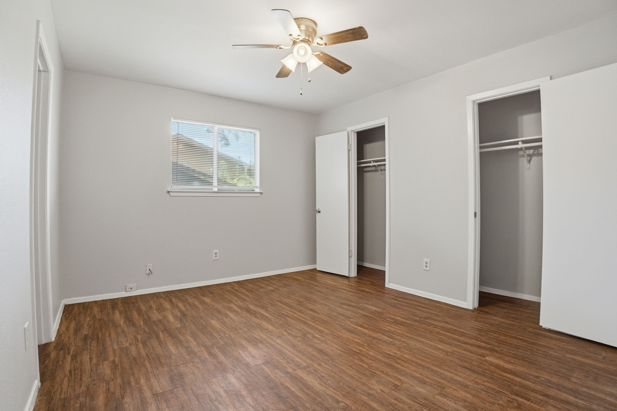 5204 Nuckols Crossing Road, Unit B Austin, TX 78744 - Photo 8 of 16 a view of an empty room with wooden floor