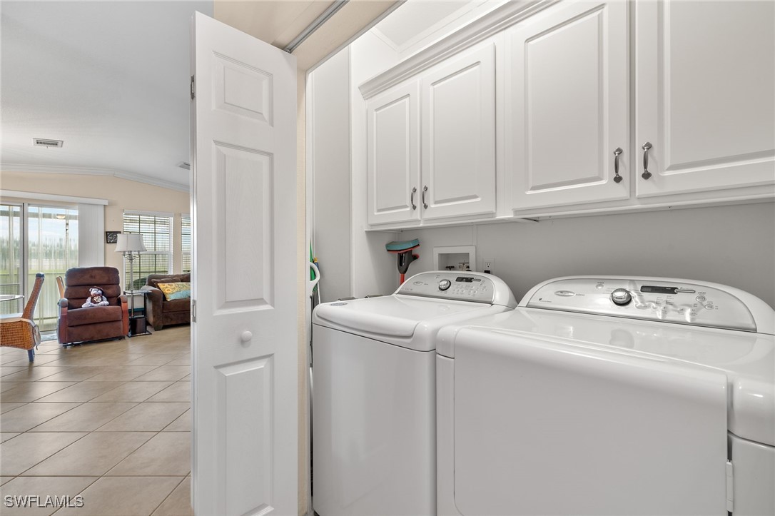 3057 Waterview Point Naples, FL 34120 - Photo 13 of 31 a utility room with dryer and washer