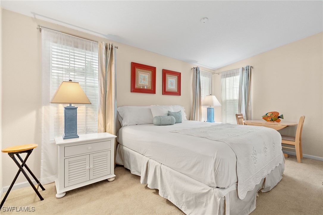 3057 Waterview Point Naples, FL 34120 - Photo 14 of 31 a bedroom with a bed and a dresser