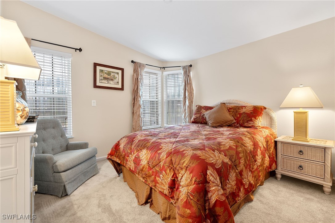 3057 Waterview Point Naples, FL 34120 - Photo 19 of 31 a bedroom with bed and a couch