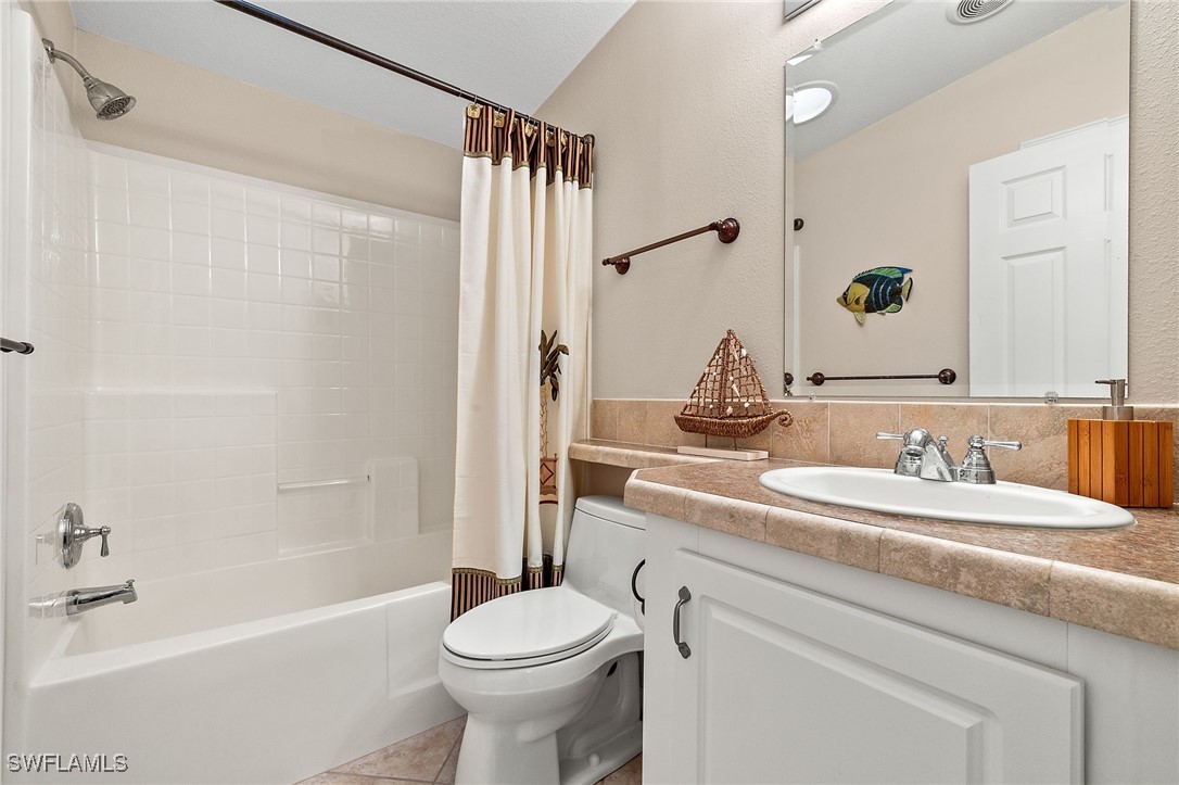 3057 Waterview Point Naples, FL 34120 - Photo 21 of 31 a bathroom with a sink toilet and shower
