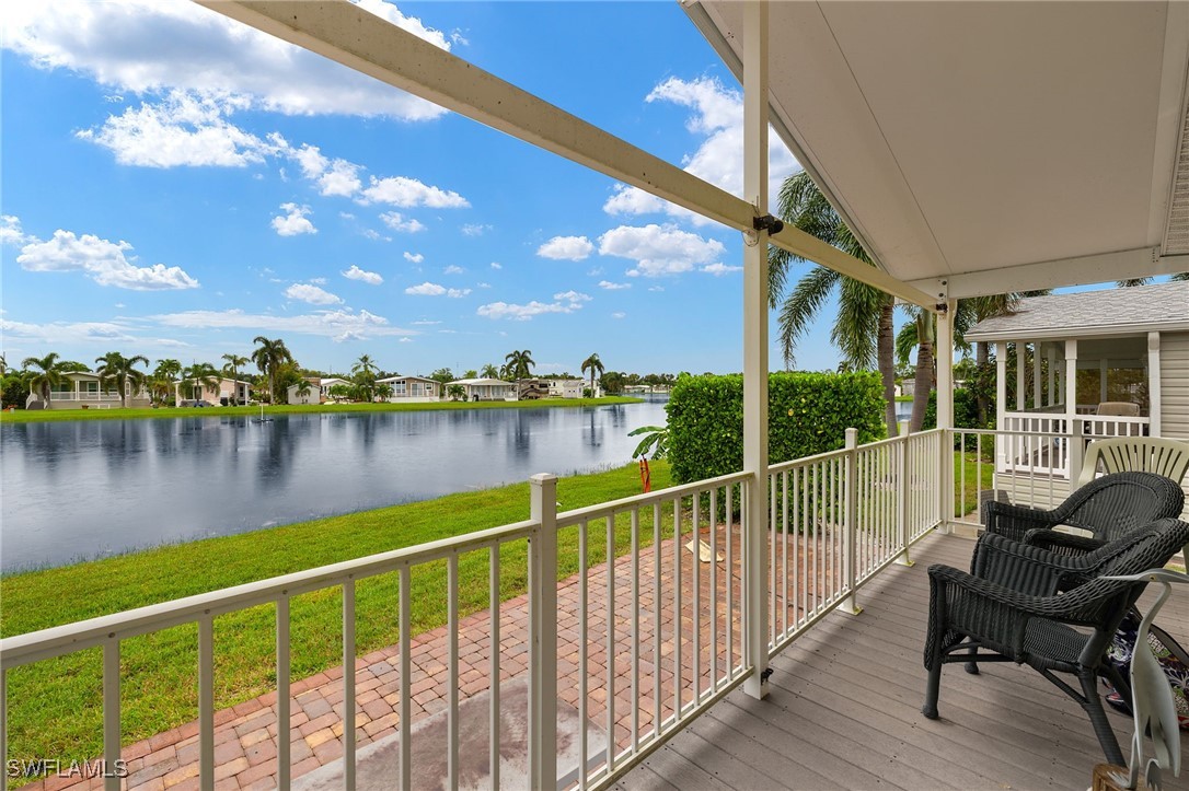 3057 Waterview Point Naples, FL 34120 - Photo 22 of 31 a view of a chair and table in the balcony