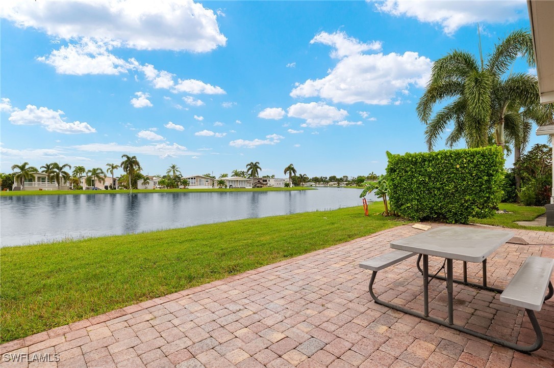 3057 Waterview Point Naples, FL 34120 - Photo 23 of 31 a view of a lake with a yard