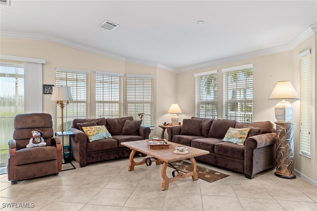 3057 Waterview Point Naples, FL 34120 - Photo 3 of 31 a living room with furniture and a window