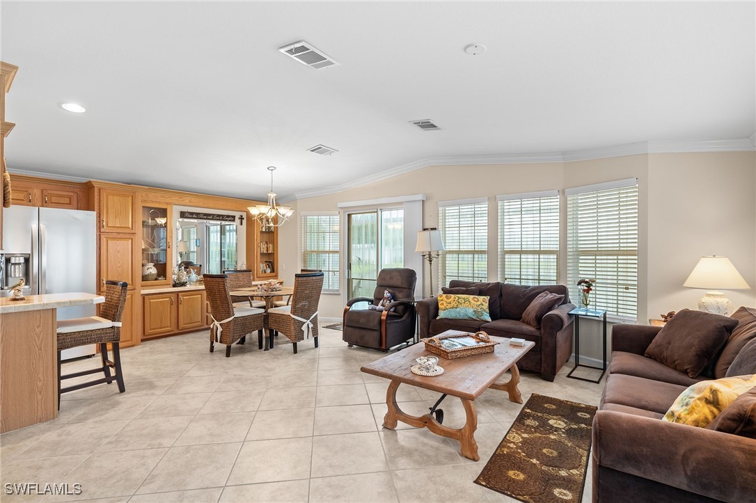 3057 Waterview Point Naples, FL 34120 - Photo 4 of 31 a living room with furniture and a large window