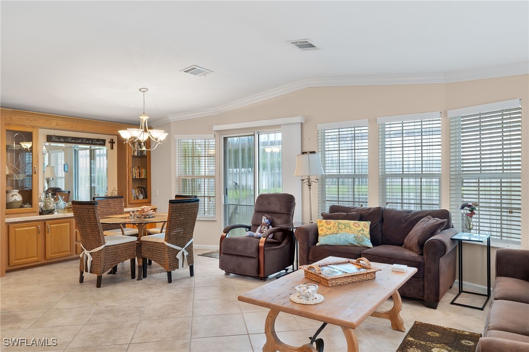 3057 Waterview Point Naples, FL 34120 - Photo 5 of 31 a living room with furniture and floor to ceiling windows