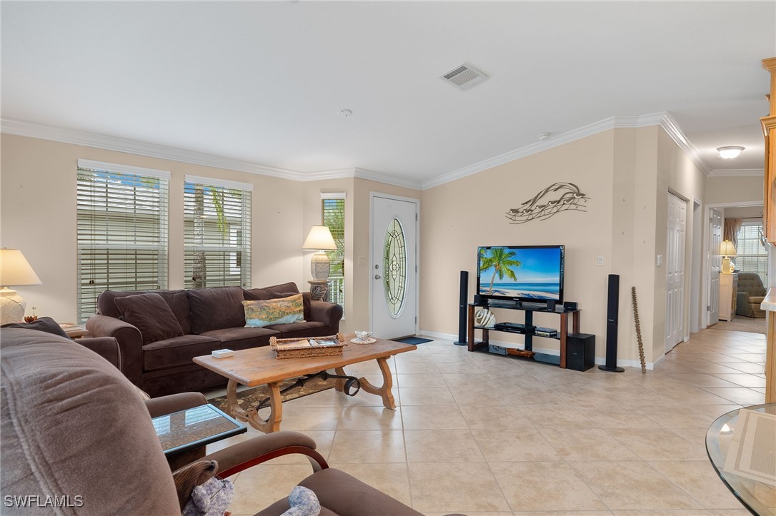 3057 Waterview Point Naples, FL 34120 - Photo 6 of 31 a living room with furniture and a flat screen tv
