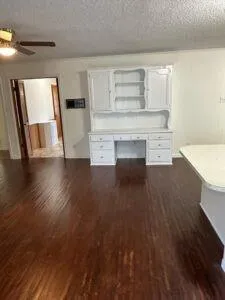 a view of a kitchen with a sink cabinets and a fireplace