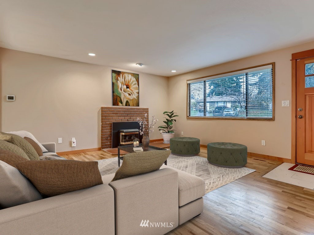 102 233rd Place Southwest Bothell, WA 98021 - Photo 5 of 26 a living room with furniture and a fireplace