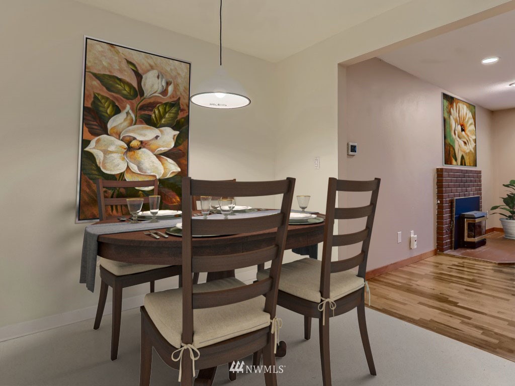 102 233rd Place Southwest Bothell, WA 98021 - Photo 7 of 26 a view of a dining room with furniture and wooden floor