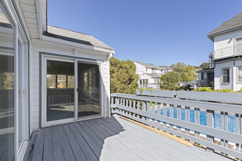 15 South Fairview Street, Unit 3 Boston, MA 02131 - Photo 23 of 29 a view of a balcony with wooden floor and fence