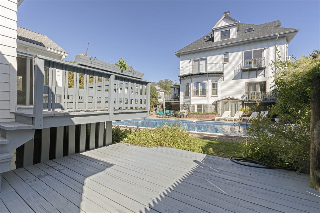 15 South Fairview Street, Unit 3 Boston, MA 02131 - Photo 24 of 29 a view of a house with a wooden deck