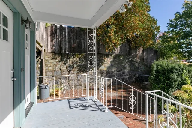 a view of backyard with outdoor seating and trees