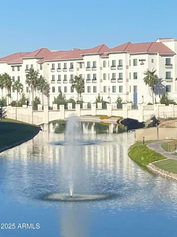 a view of a swimming pool with outdoor seating