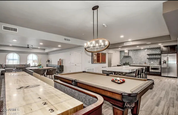 a room with furniture and kitchen view