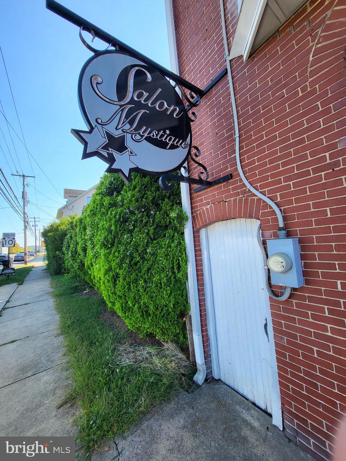 402 Morgantown Road Reading, PA 19611 - Photo 2 of 47 a sign on a brick wall