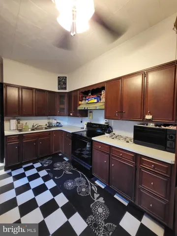 a kitchen with stainless steel appliances granite countertop a sink and cabinets