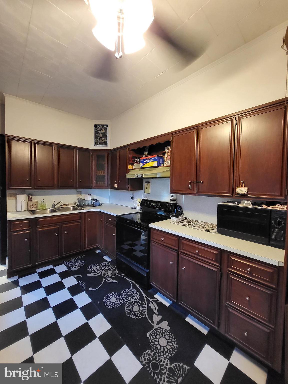 402 Morgantown Road Reading, PA 19611 - Photo 24 of 47 a kitchen with stainless steel appliances granite countertop a sink and cabinets