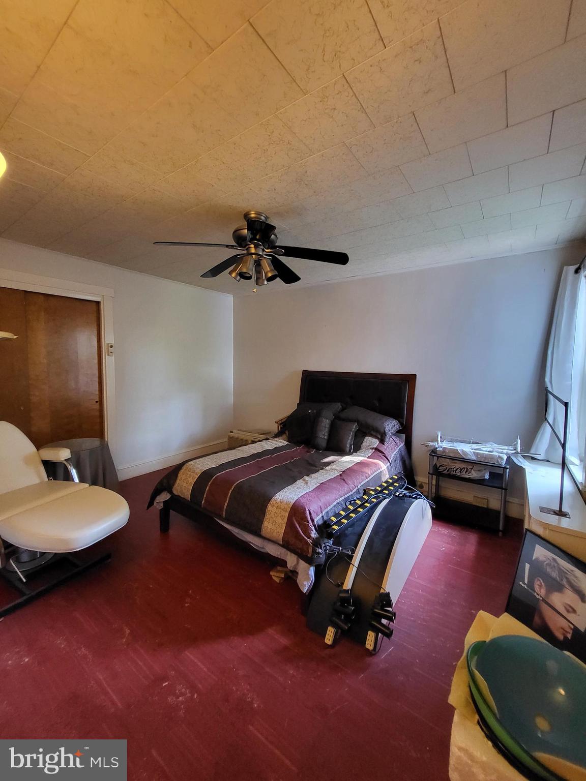 402 Morgantown Road Reading, PA 19611 - Photo 31 of 47 a bedroom with a bed and a couch