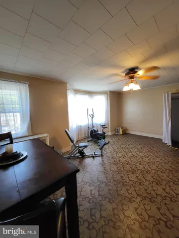 a view of a workspace with furniture