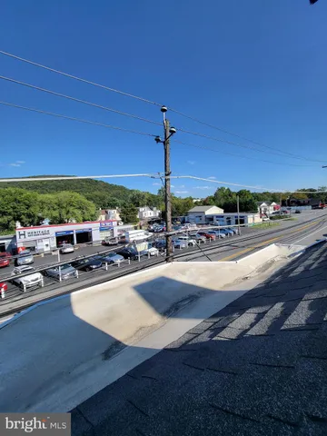 a view of a swimming pool with a patio