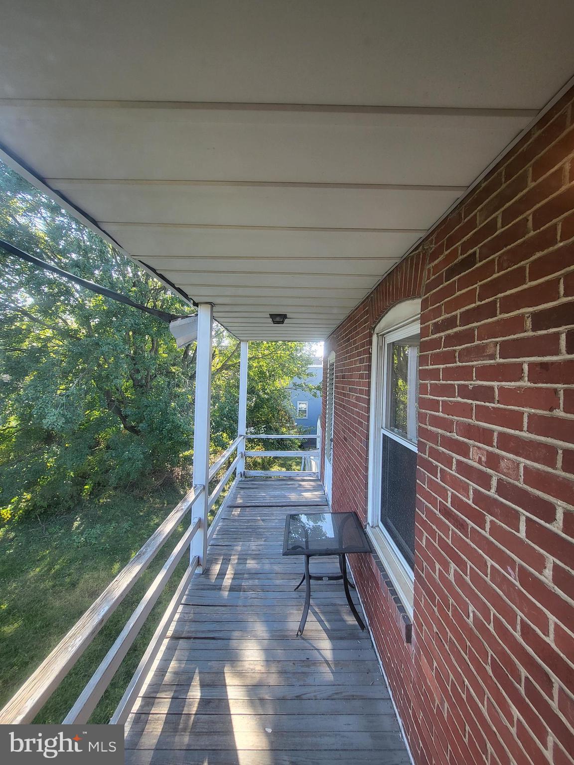 402 Morgantown Road Reading, PA 19611 - Photo 43 of 47 a view of a patio with wooden floor and iron stairs