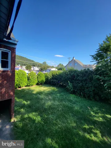 a view of a garden with an outdoor space