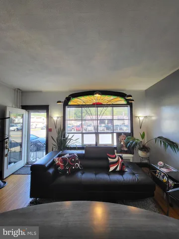 a room with a bed and a large window