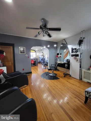 a view of a living room and kitchen with furniture