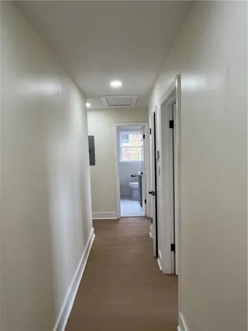 a view of an empty room with a window