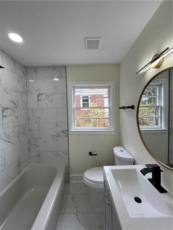 1645 Metropolitan Parkway Southwest, Unit A Atlanta, GA 30310 - Photo 18 of 26 a bathroom with a sink mirror toilet and bathtub